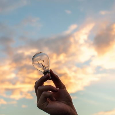 Marketing ideas image of a lightbulb in front of a pretty sky